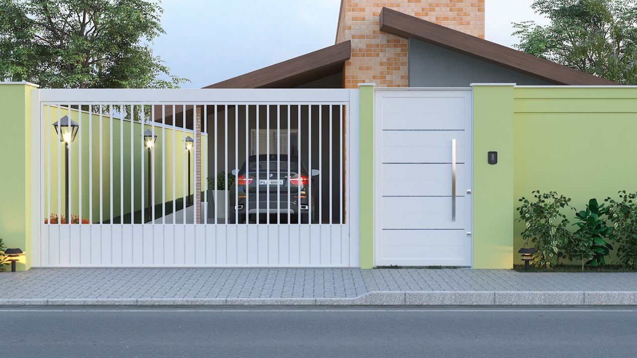 casa com portão branco e muros em tom verde-claro